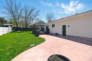 View of yard with a patio area and a wooden deck
