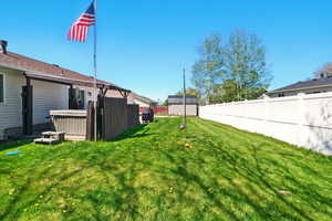 View of yard with a hot tub