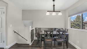 Dining area with wood finished floors and baseboards