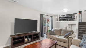 Living area featuring carpet flooring and stairway