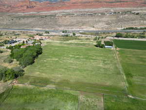Aerial view of property's location with rural landscape and mountains