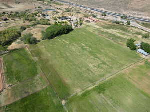 Aerial view of property and surrounding area featuring rural landscape