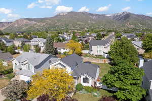 Aerial perspective of suburban area featuring a mountain backdrop