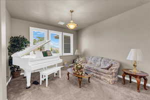 Sitting room with carpet and baseboards