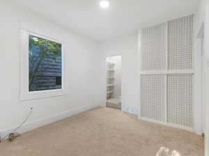Unfurnished bedroom featuring carpet flooring and baseboards