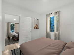Carpeted bedroom with multiple windows