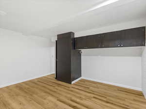 Empty room featuring light wood-style floors and baseboards