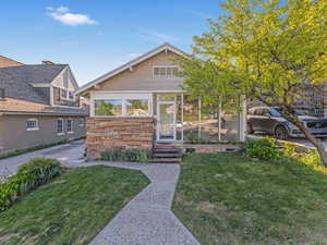 View of front of house with a front lawn