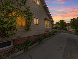 View of property exterior at dusk