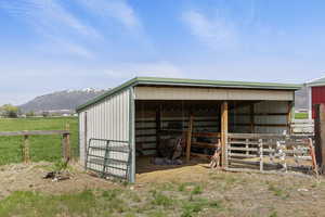 View of outdoor structure featuring an outdoor structure, a mountain view, and an exterior structure