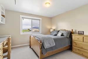 Carpeted bedroom with baseboards