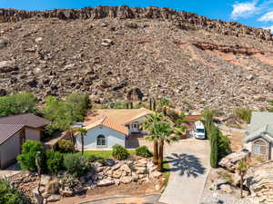 View of subject property with mountains
