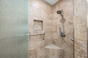 Full bath with a shower stall