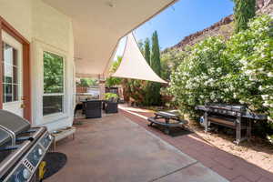View of patio / terrace featuring a mountain view, an outdoor hangout area, outdoor dining area, and fence