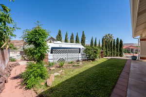 View of yard with an attached garage