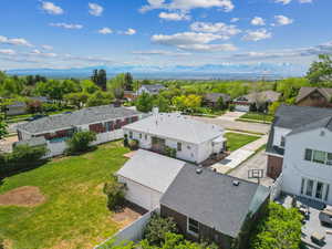 Aerial perspective of suburban area with a mountain backdrop