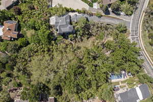 Aerial view of property's location with a pool area and nearby suburban area