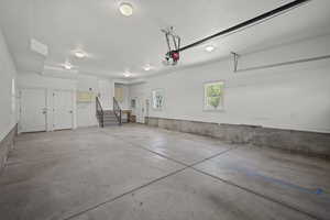 Garage featuring a garage door opener