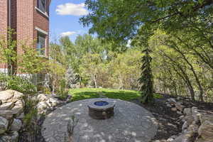 View of patio featuring a fire pit
