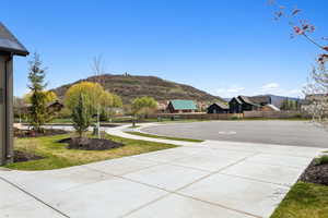 View of yard featuring fence and a mountain view