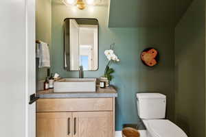 Bathroom with toilet and vanity