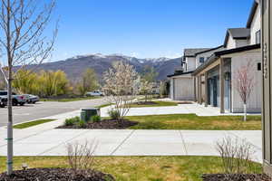 View of green lawn featuring a mountain view