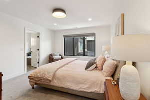 Bedroom with carpet floors, recessed lighting, and baseboards