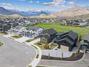 Aerial perspective of suburban area with a mountainous background