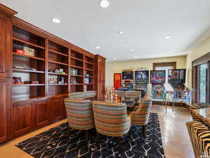 Dining area featuring recessed lighting and light tile patterned floors