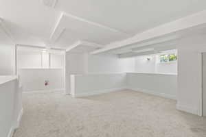 Basement with carpet and baseboards