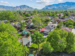 Aerial view of residential area featuring a mountainous background