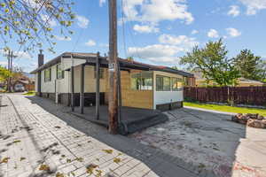 Back of house with fence
