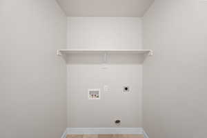 Washroom with hookup for an electric dryer and washer hookup