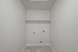 Laundry room with hookup for a washing machine and hookup for an electric dryer