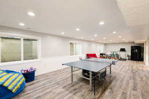 Recreation room featuring LVP finished floors and recessed lighting