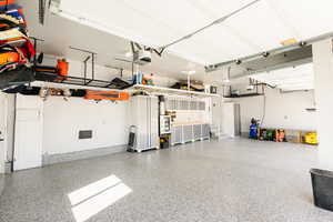 Garage featuring a garage door opener