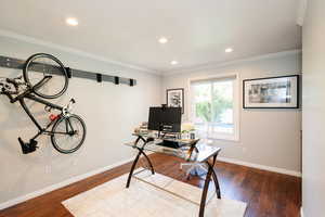 Office area with baseboards, wood-type flooring, ornamental molding, and recessed lighting