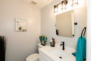 Bathroom featuring toilet and vanity