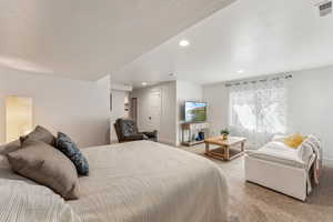 Basement bedroom with carpet, recessed lighting, and baseboards