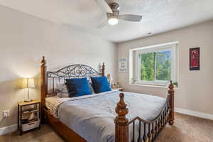 Primary bedroom a ceiling fan, walk-in closet and en-suite bathroom
