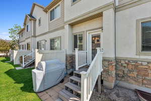 Back of house with patio area for bbq or outdoor seating
