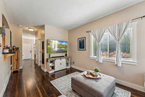 Living room, entryway and door to main floor half bath