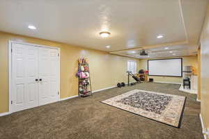 Cinema room featuring carpet, recessed lighting, and baseboards