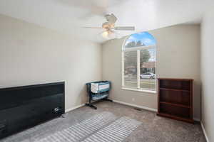 Bedroom with carpet, baseboards, and ceiling fan