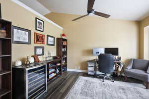 Office with wine cooler, lofted ceiling, a ceiling fan, wood finished floors, and baseboards