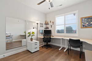 Office area featuring wood finished floors, ceiling fan, and baseboards