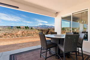View of patio / terrace with a mountain view and outdoor dining space