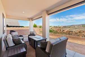 View of patio / terrace featuring an outdoor hangout area and a mountain view