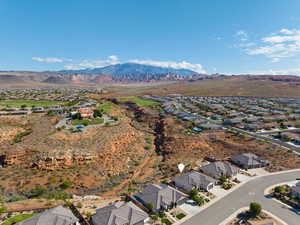 View of property location featuring nearby suburban area and a mountainous background