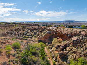 View of mountain backdrop with nearby suburban area